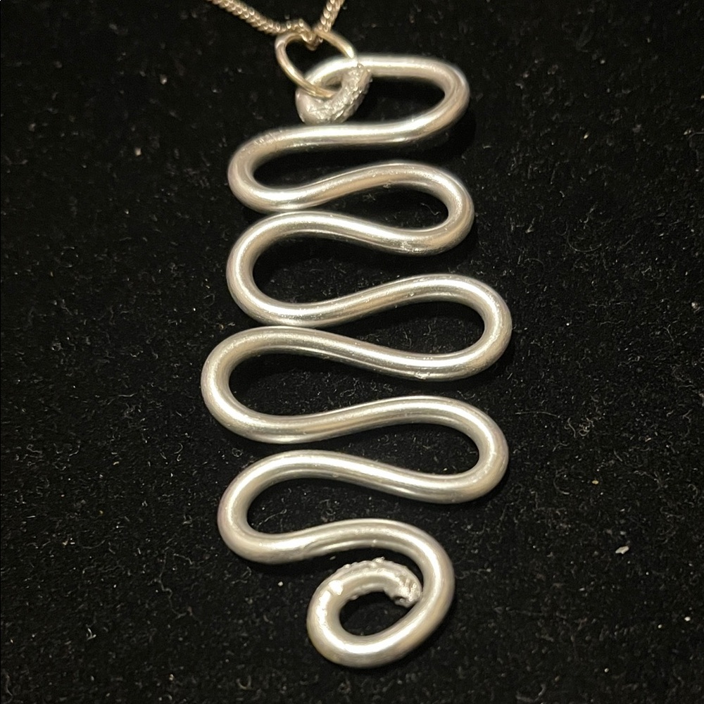 Elegant Silver Wave Hand Design Necklace - Picture 3 of 17